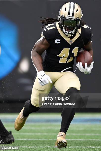 Alvin Kamara of the New Orleans Saints runs with the ball against the Carolina Panthers during the first quarter at Bank of America Stadium on...