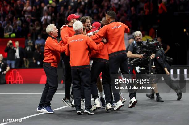 Frances Tiafoe of Team World celebrates with teammates after winning the Laver Cup during Day Three of the Laver Cup at The O2 Arena on September 25,...