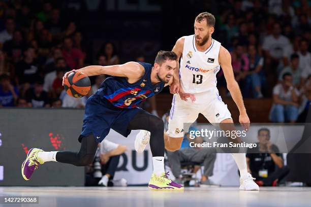 Sergio Rodriguez of Real Madrid battles for the ball with Tomas Satoransky of FC Barcelona during the Supercopa Endesa final match between Real...