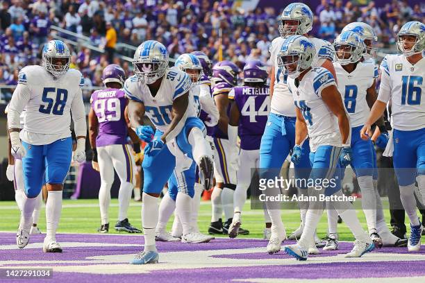 Running back Jamaal Williams of the Detroit Lions celebrates after scoring a touchdown in the first quarter of the game against the Minnesota Vikings...