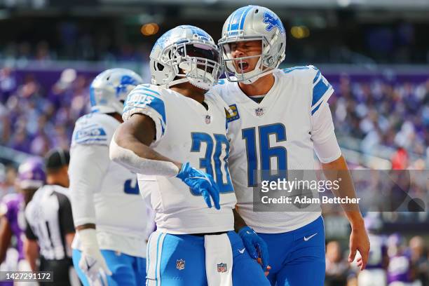 Running back Jamaal Williams celebrates with quarterback Jared Goff of the Detroit Lions after scoring a touchdown in the first quarter of the game...