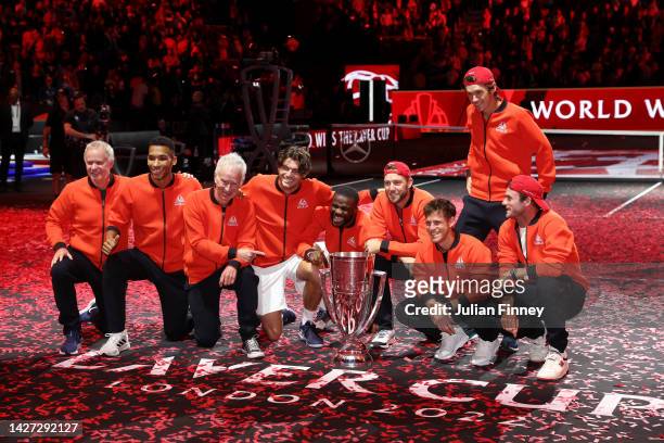 Players of Team World celebrate with the Laver Cup trophy during Day Three of the Laver Cup at The O2 Arena on September 25, 2022 in London, England.