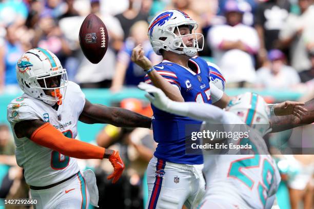 Quarterback Josh Allen of the Buffalo Bills loses control of the ball during the first half of the game against the Miami Dolphins at Hard Rock...