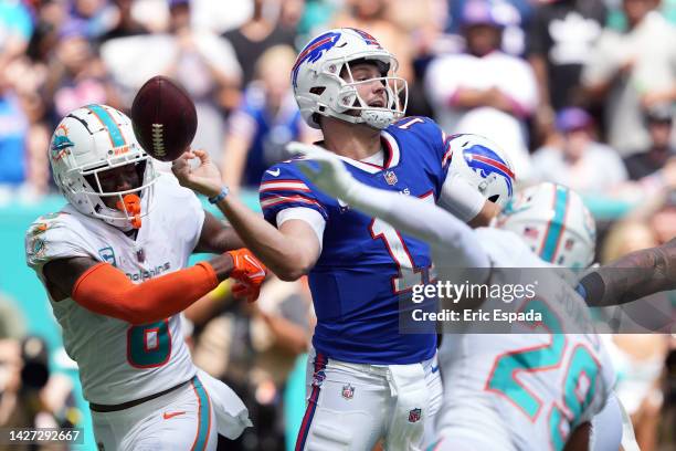 Quarterback Josh Allen of the Buffalo Bills loses control of the ball during the first half of the game against the Miami Dolphins at Hard Rock...