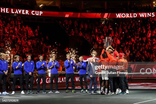 Players of Team World celebrate with the Laver Cup trophy during Day Three of the Laver Cup at The O2 Arena on September 25, 2022 in London, England.