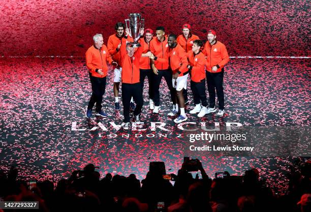 John McEnroe, Captain of Team World celebrates with the Laver Cup trophy alongside fellow players of Team World after winning the Laver Cup on Day...