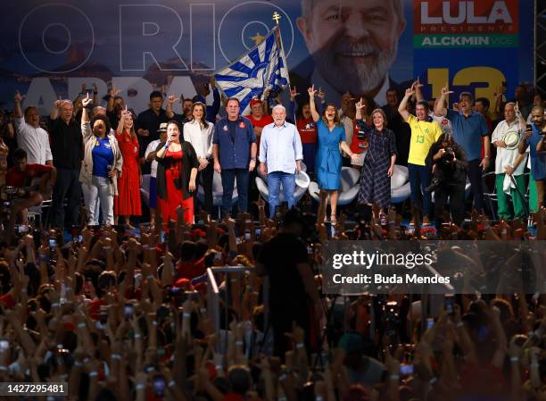 Brazil's former president and current presidential candidate Luiz Inacio Lula da Silva sings the national anthem during a campaign rally in the final...