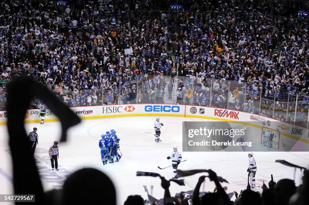 Fans wave their towels to celebrate the goal of Alexander Edler of the Vancouver Canucks on Jonathan Quick of the Los Angeles Kings in Game One of...