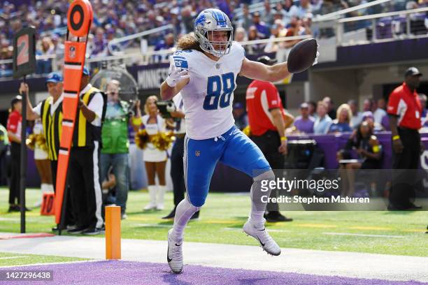 Tight end T.J. Hockenson of the Detroit Lions reacts as he scores on a pass reception in the second quarter of the game against the Minnesota Vikings...