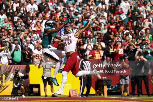 Cornerback Benjamin St-Juste of the Washington Commanders defends a pass intended for wide receiver DeVonta Smith of the Philadelphia Eagles during...