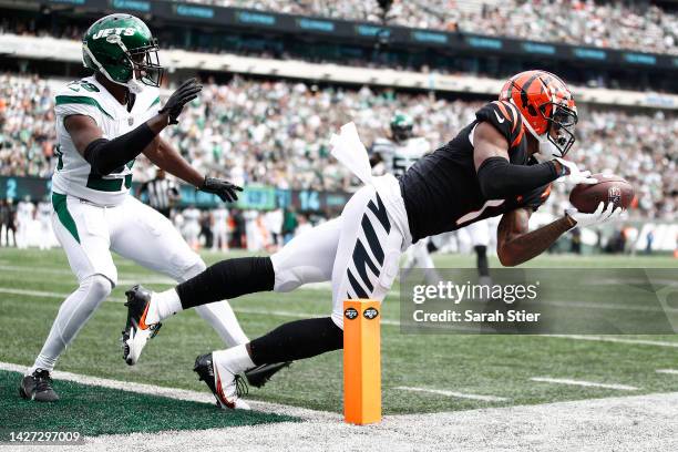 Ja'Marr Chase of the Cincinnati Bengals makes a catch for a gain while defended by Lamarcus Joyner of the New York Jets during the first half at...