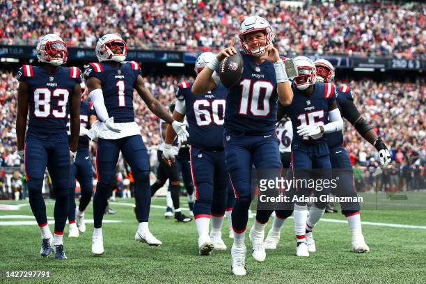 Quarterback Mac Jones of the New England Patriots celebrates after scoring a touchdown during the second quarter at Gillette Stadium on September 25,...