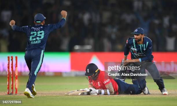 Reece Topley of England reacts as he is run out by Shan Masood of Pakistan to lose the 4th IT20 between Pakistan and England at Karachi National...