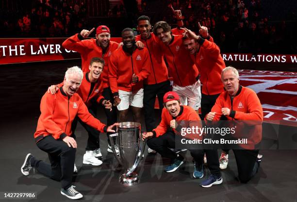 Players of Team World celebrate with the Laver Cup trophy during Day Three of the Laver Cup at The O2 Arena on September 25, 2022 in London, England.