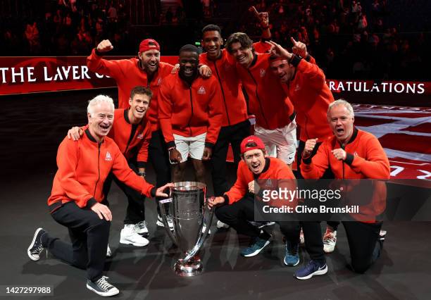 Players of Team World celebrate with the Laver Cup trophy during Day Three of the Laver Cup at The O2 Arena on September 25, 2022 in London, England.