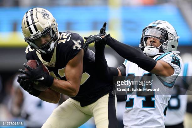 Chris Olave of the New Orleans Saints makes a catch against CJ Henderson of the Carolina Panthers during the second quarter at Bank of America...