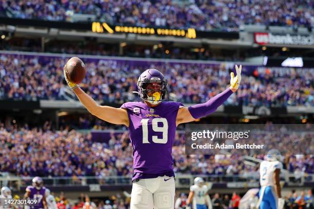 Wide receiver Adam Thielen of the Minnesota Vikings reacts after scoring a touchdown in the second quarter of the game against the Detroit Lionsat...