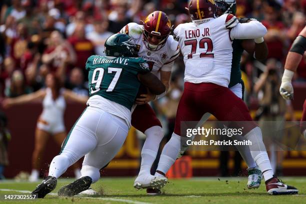 Defensive tackle Javon Hargrave of the Philadelphia Eagles sacks quarterback Carson Wentz of the Washington Commanders during the first half at...