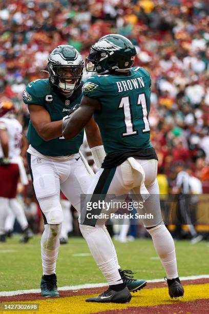 Quarterback Jalen Hurts of the Philadelphia Eagles celebrates with wide receiver A.J. Brown of the Philadelphia Eagles after Brown's touchdown during...