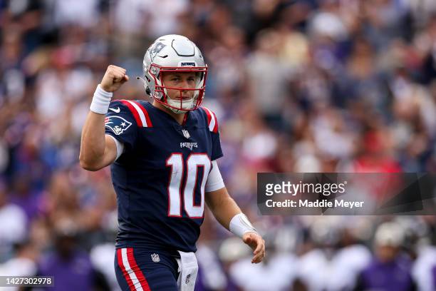 Quarterback Mac Jones of the New England Patriots reacts after a play during the first half against the Baltimore Ravens at Gillette Stadium on...
