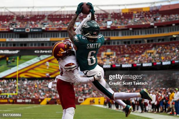 Wide receiver DeVonta Smith of the Philadelphia Eagles catches a touchdown over cornerback Kendall Fuller of the Washington Commanders during the...