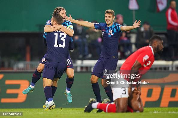 Luka Modric of Croatia celebrates with teammates after scoring