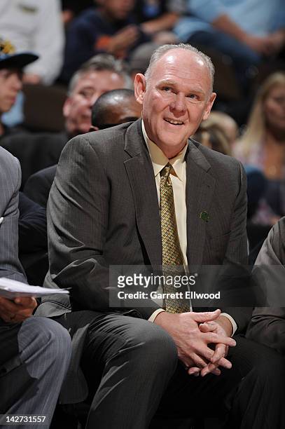 Head Coach George Karl of the Denver Nuggets smiles from the bench during the game between the Denver Nuggets and the Minnesota Timberwolves on April...