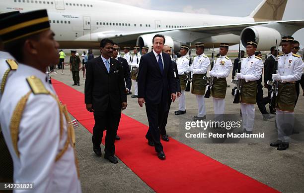 Prime Minister David Cameron walks past a guard of honour on arrival on April 12, 2012 in Kuala Lumpur, Malaysia. Mr Cameron is on a five day visit...