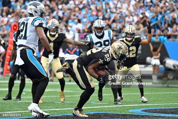 Mark Ingram II of the New Orleans Saints scores a touchdown in front of Jeremy Chinn of the Carolina Panthers during the fourth quarter at Bank of...