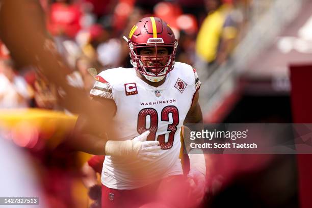 Defensive tackle Jonathan Allen of the Washington Commanders runs onto the field pregame against the Philadelphia Eagles at FedExField on September...