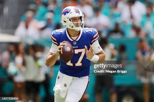 Quarterback Josh Allen of the Buffalo Bills rolls out of the pocket during the game against the Miami Dolphins at Hard Rock Stadium on September 25,...