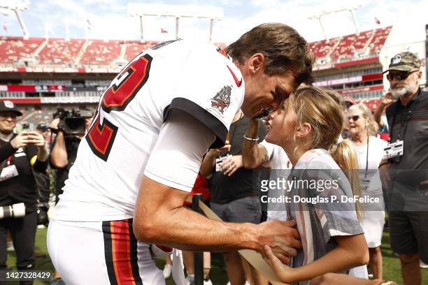 Tom Brady of the Tampa Bay Buccaneers talks with his daughter Vivian on the sidelines prior to the game against the Green Bay Packers at Raymond...