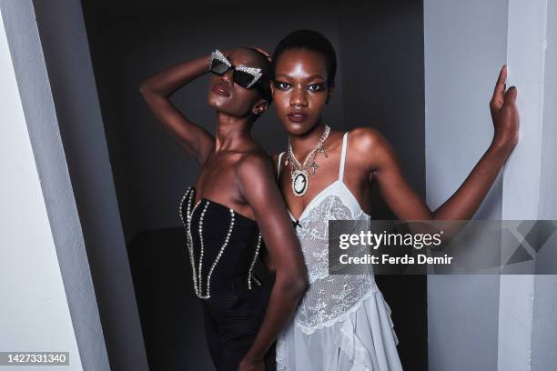 Models pose backstage at the Aniye Records Fashion Show during the Milan Fashion Week Womenswear Spring/Summer 2023 on September 25, 2022 in Milan,...