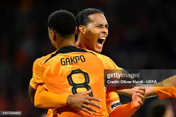 Virgil van Dijk of Netherlands celebrates with teammate Cody Gakpo after scoring their team's first goal during the UEFA Nations League League A...