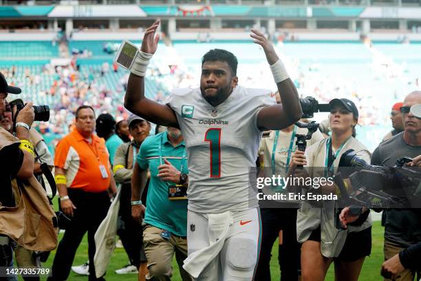 Quarterback Tua Tagovailoa of the Miami Dolphins celebrates after his team beat the Buffalo Bills 21-19 at Hard Rock Stadium on September 25, 2022 in...