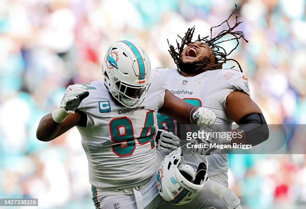 Christian Wilkins and Robert Hunt of the Miami Dolphins celebrate after a stop against the Buffalo Bills during the fourth quarter at Hard Rock...