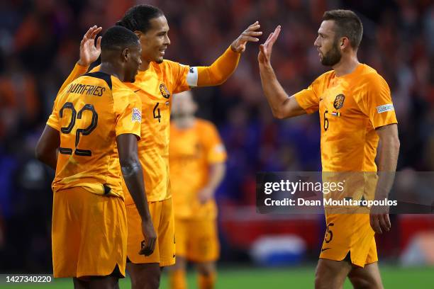 Virgil van Dijk of Netherlands celebrates victory with teammates Denzel Dumfries and Stefan de Vrij following the UEFA Nations League League A Group...