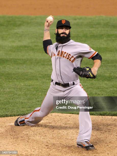 Brian Wilson of the San Francisco Giants pitches in relief against the Colorado Rockies at Coors Field on April 11, 2012 in Denver, Colorado. The...