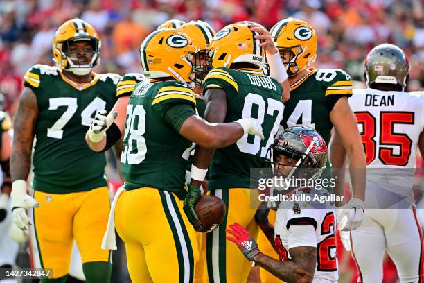 Romeo Doubs of the Green Bay Packers celebrates with his teammates after scoring a touchdown against the Tampa Bay Buccaneers during the first...