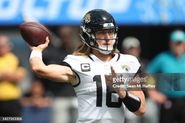 Trevor Lawrence of the Jacksonville Jaguars warms up before his game against the Los Angeles Chargers at SoFi Stadium on September 25, 2022 in...