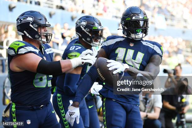 Metcalf of the Seattle Seahawks reacts after scoring a touchdown against the Atlanta Falcons during the second quarter at Lumen Field on September...