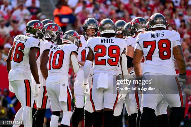 Tom Brady of the Tampa Bay Buccaneers huddles with his team against the Green Bay Packers during the second quarter in the game at Raymond James...