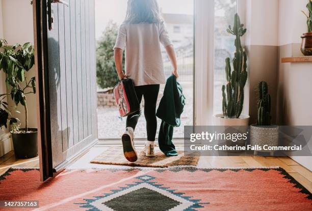 a little girl leaves her house to go to school - elementary school stock pictures, royalty-free photos & images