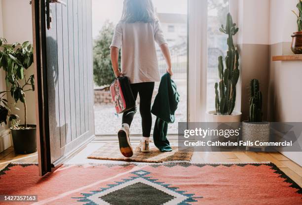 a little girl leaves her house to go to school - leaving school imagens e fotografias de stock