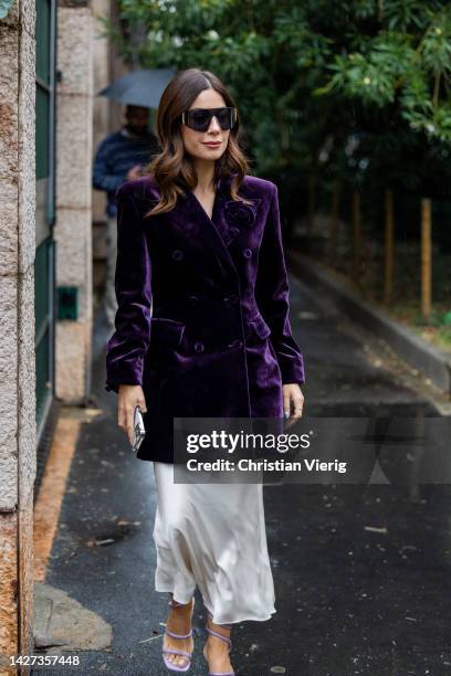 Valentina Marzullo wears purple double breasted blazer, white silk dress, sandals outside Ermanno Scervino during the Milan Fashion Week - Womenswear...