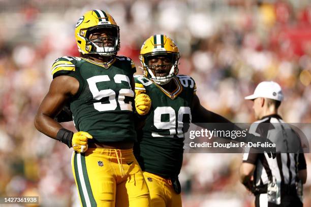 Rashan Gary of the Green Bay Packers celebrates with Jarran Reed after sacking Tom Brady of the Tampa Bay Buccaneers during the second quarter in the...