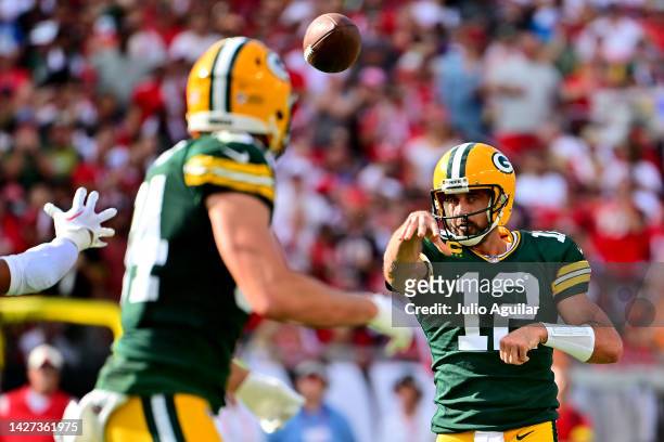 Aaron Rodgers of the Green Bay Packers throws a pass to Tyler Davis against the Tampa Bay Buccaneers during the second quarter in the game at Raymond...