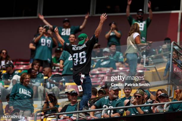 Philadelphia Eagles fans cheer during their game against the Washington Commanders at FedExField on September 25, 2022 in Landover, Maryland.