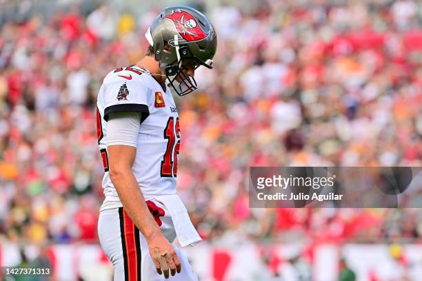 Tom Brady of the Tampa Bay Buccaneers walks with the sidelines against the Green Bay Packers during the fourth quarter in the game at Raymond James...