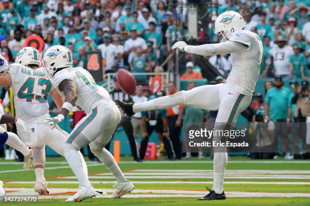 Thomas Morstead of the Miami Dolphins has his punt blocked by his own player in the fourth quarter of the game against the Buffalo Bills at Hard Rock...